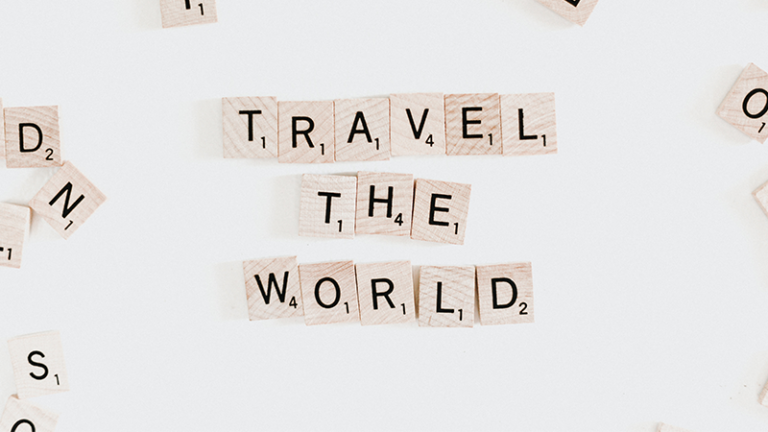 save money to travel the world scrabble pieces