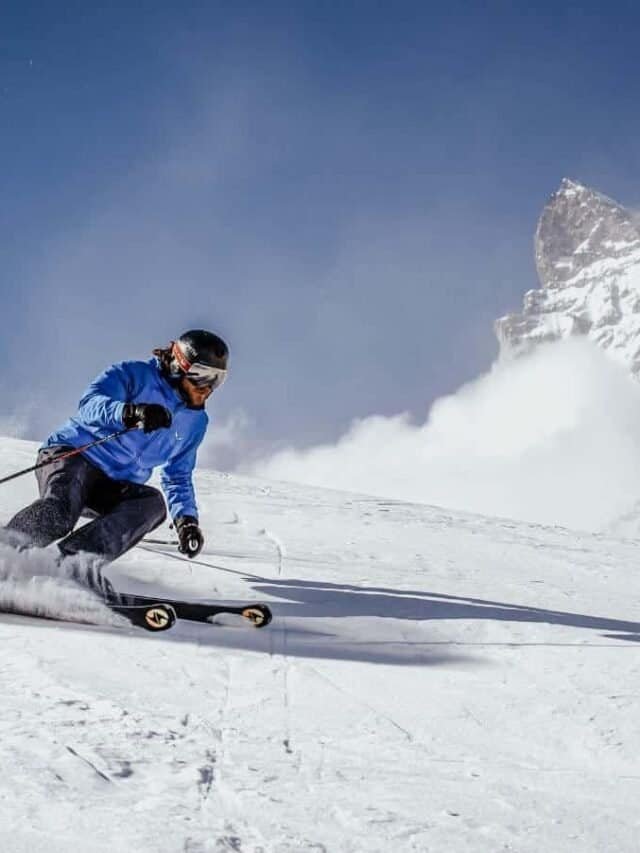 Sam carving turns on his skis in front of the Matterhorn.