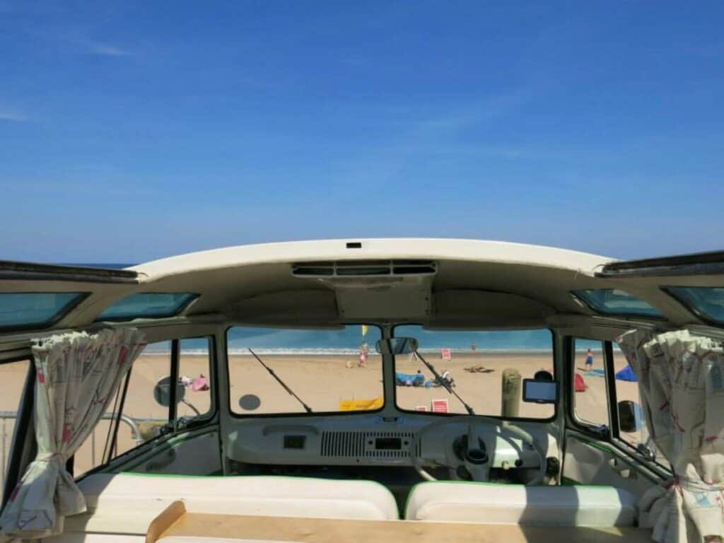 A view of Fistral Beach Cornwall from a campervan during a Cornwall Road Trip