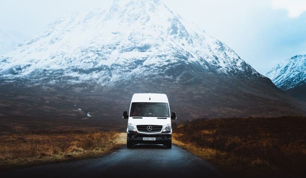 Mercedes Sprinter driving through the snowy peaks of Glencoe