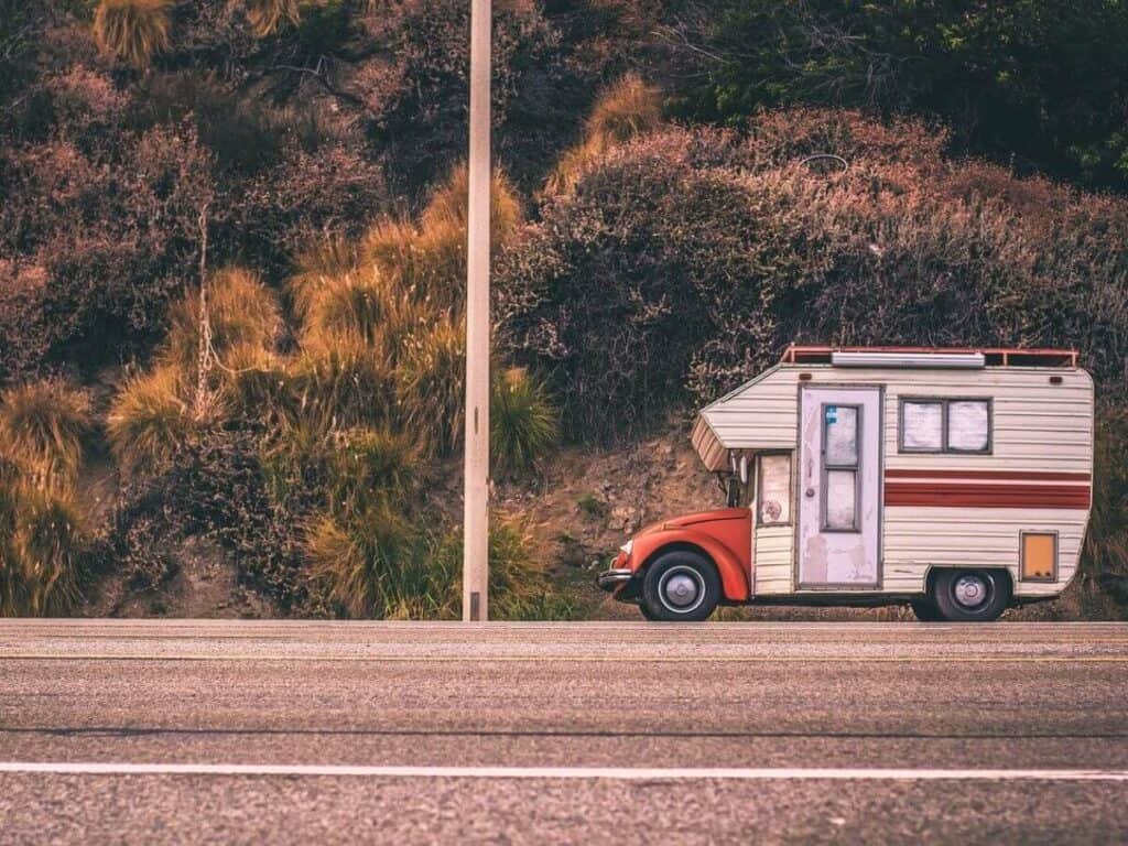 A cute little car campervan on the road, the ultimate travel vehicle for vanlife in Australia.