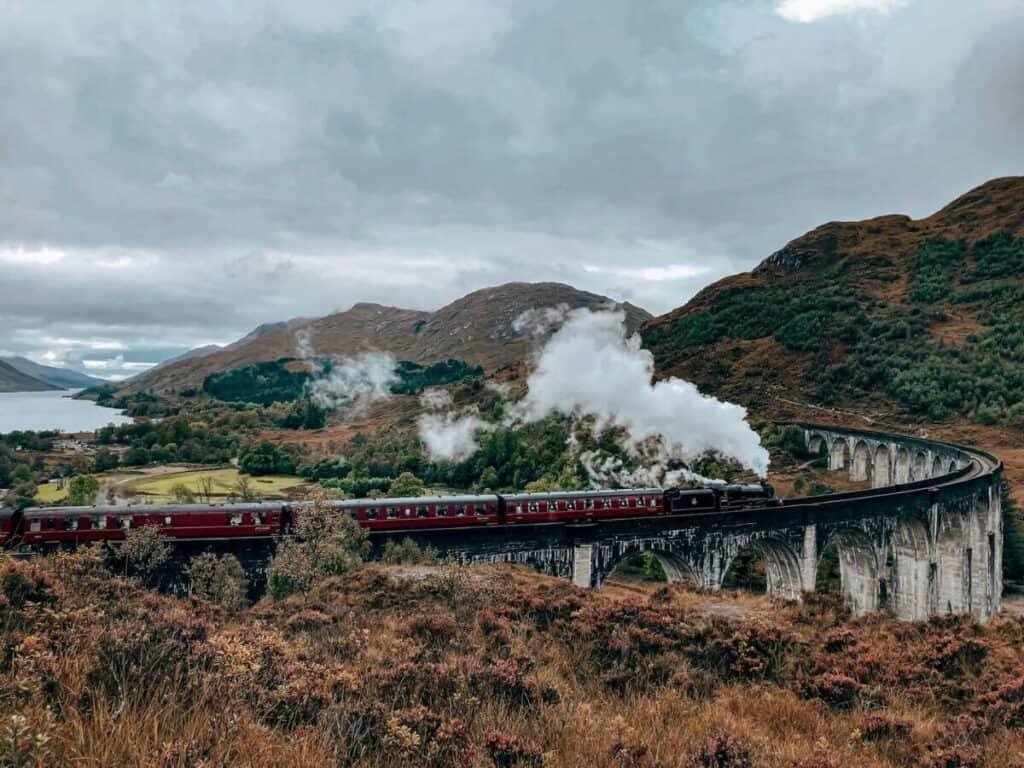 Is it safe to ride the Harry Potter train in Scotland? Absolutely, this Jacobite Train crossing the Glenfinnan Viaduct in Scotland is one of the best experiences for Potterheads.