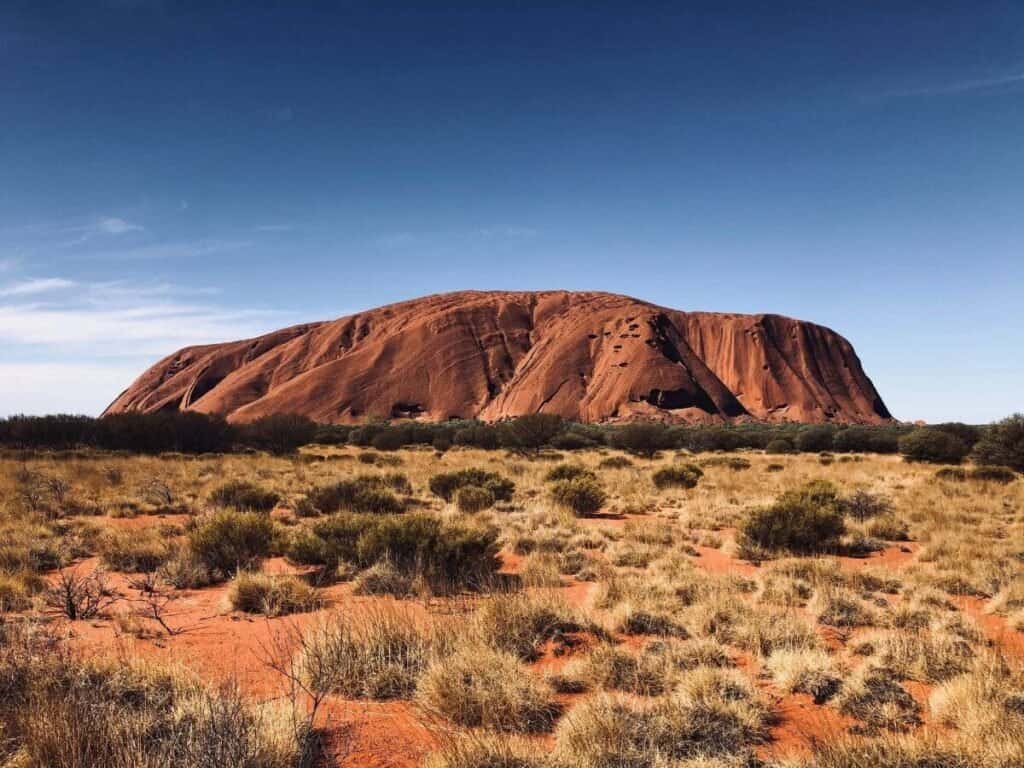 Uluru, also known as Ayres rock in Australia, a big red rock formation in the Outback.