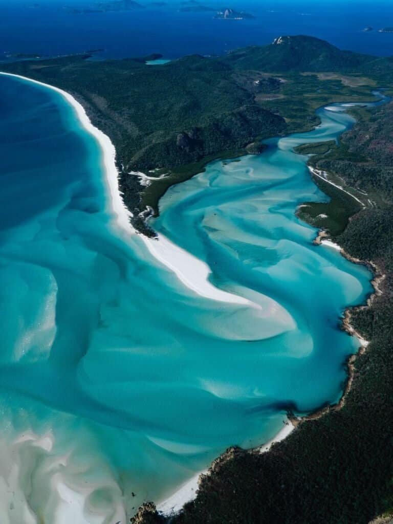 The white sand and clear blue waters of the Whitsunday Islands, make Australia worth visiting. 