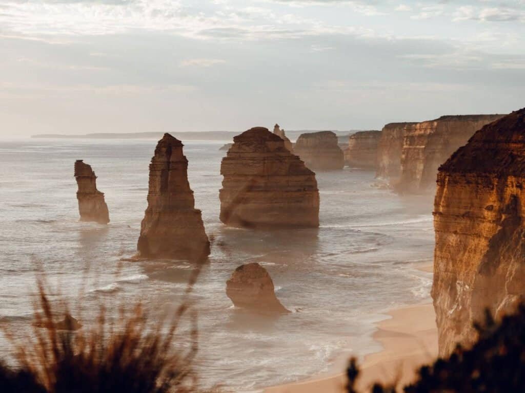 The Twelve Apostles on the Great Ocean Road, Australia, in a soft evening glow.