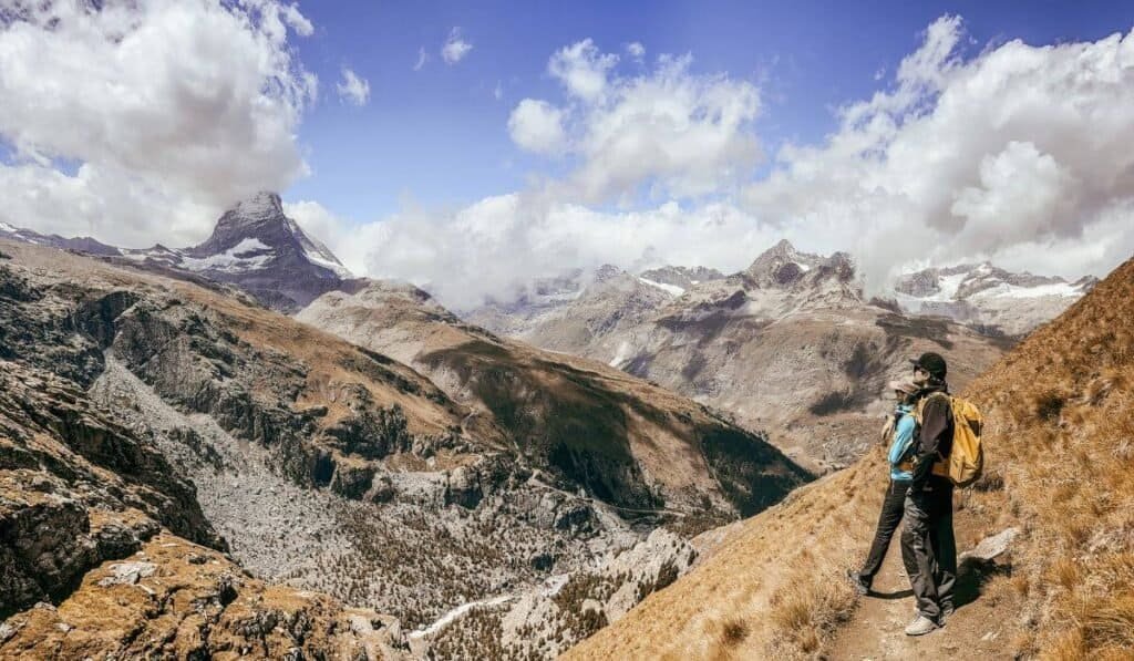 A couple stood on the trail from Riffelsee to Riffelalp, with a view of the Matterhorn.