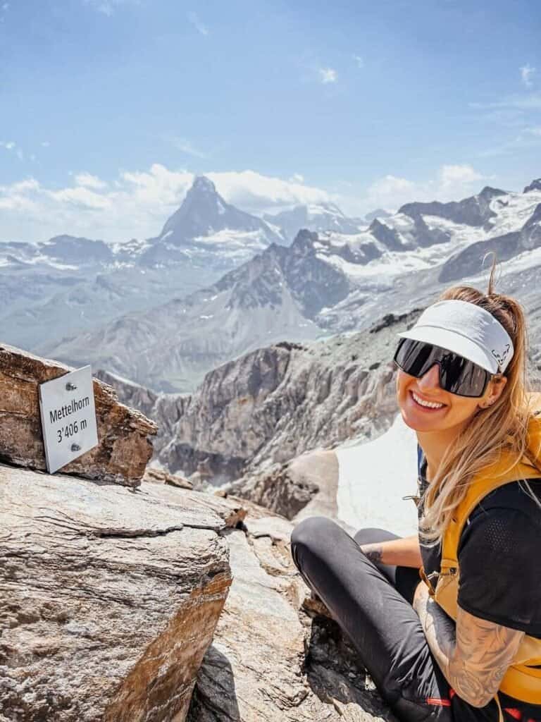 Zermatt is worth visitng to tackle one of the many trails. Here's a woman at th esummit of Mettelhorn, with the Matterhorn in the background.