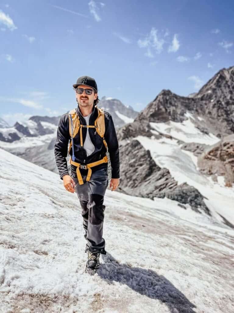 Zermatt is worth visiting for all of the free activities, like hiking. Here's a man crossing the glacier at the foot of Mettelhorn.