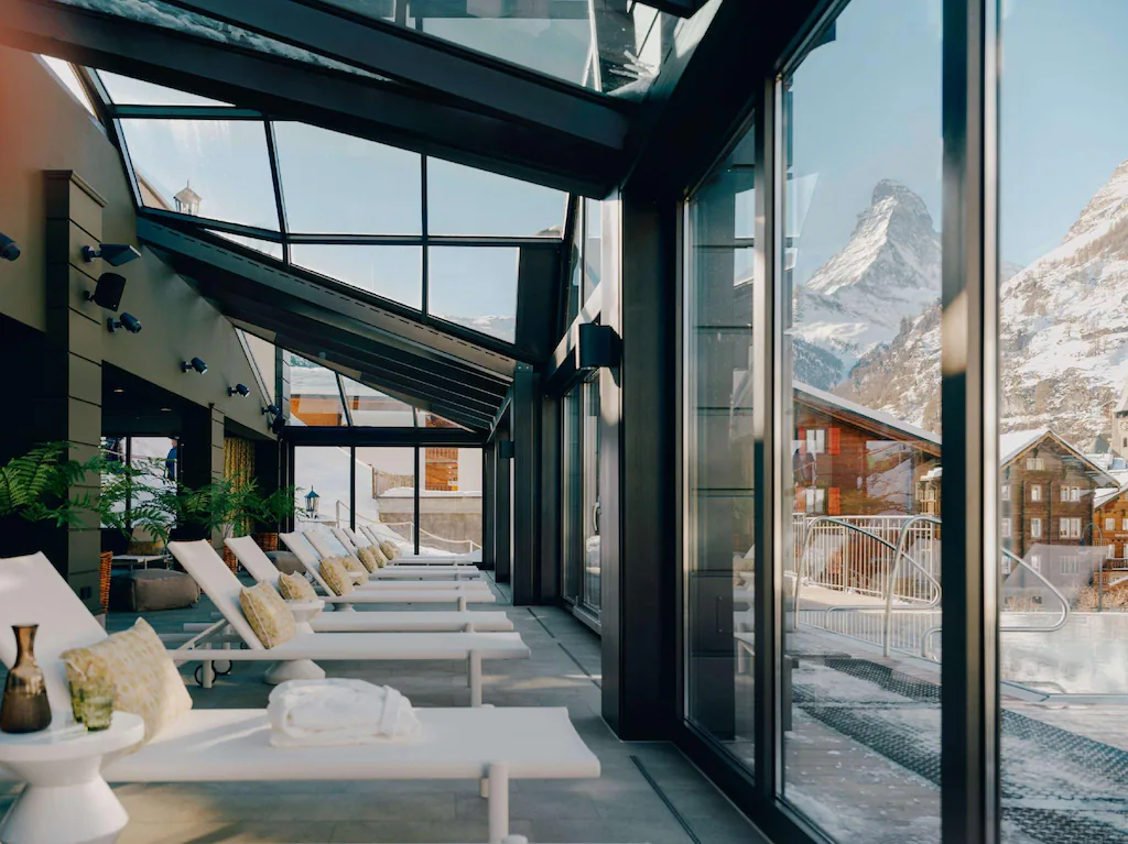 A quiet idylic relaxation area with a view of the Matterhorn, at the Park Hotel Beausite. One of the luxury Zermatt Switzerland Hotels.