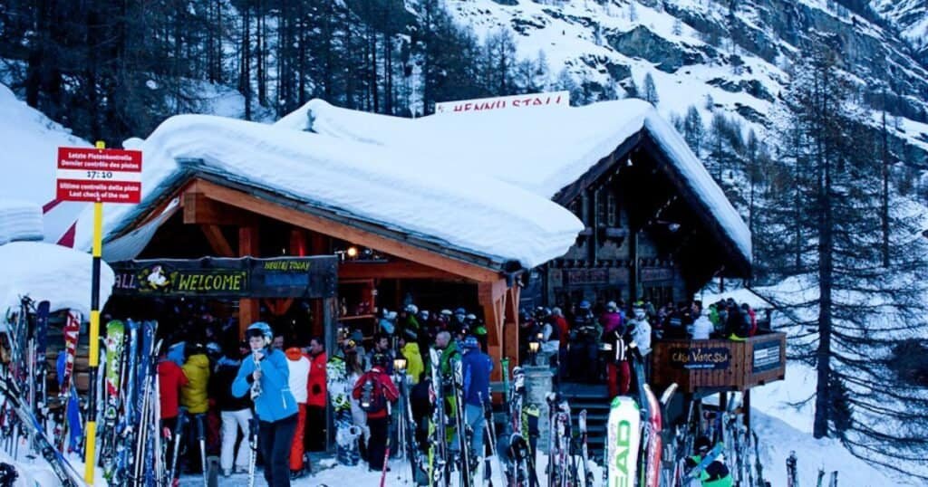 Hennu Stall après ski bar filled with party going skiers in Zermatt in December.